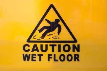 How does a warning sign affect my slip and fall claim